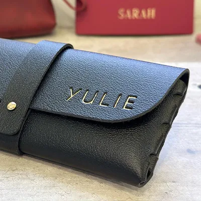 Gold foil stamped initials on leather glasses case – personalized embossing on leather accessory